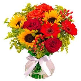 thumb-arranjo-em-tons-do-sol-rosas-girassois-e-gerberas-no-vidro-25pct-off-0